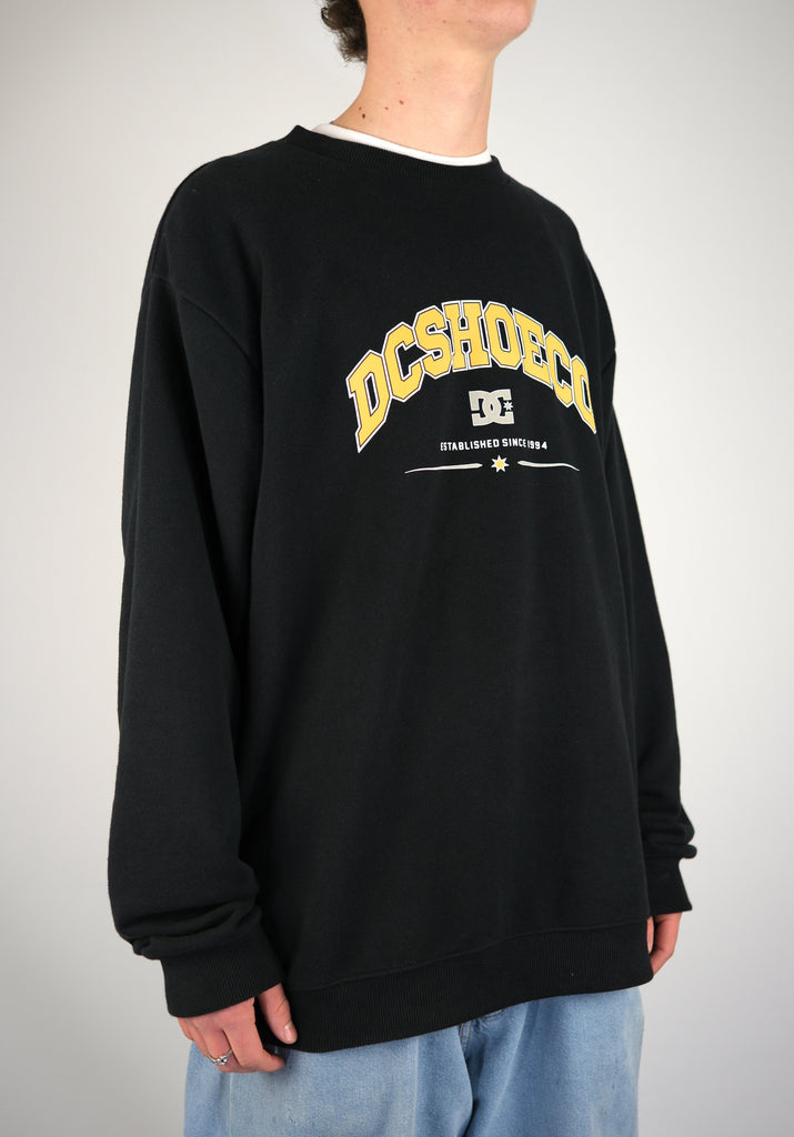 Black Terry Cloth Crew Sweatshirt featuring yellow DC Shoes logo and text design