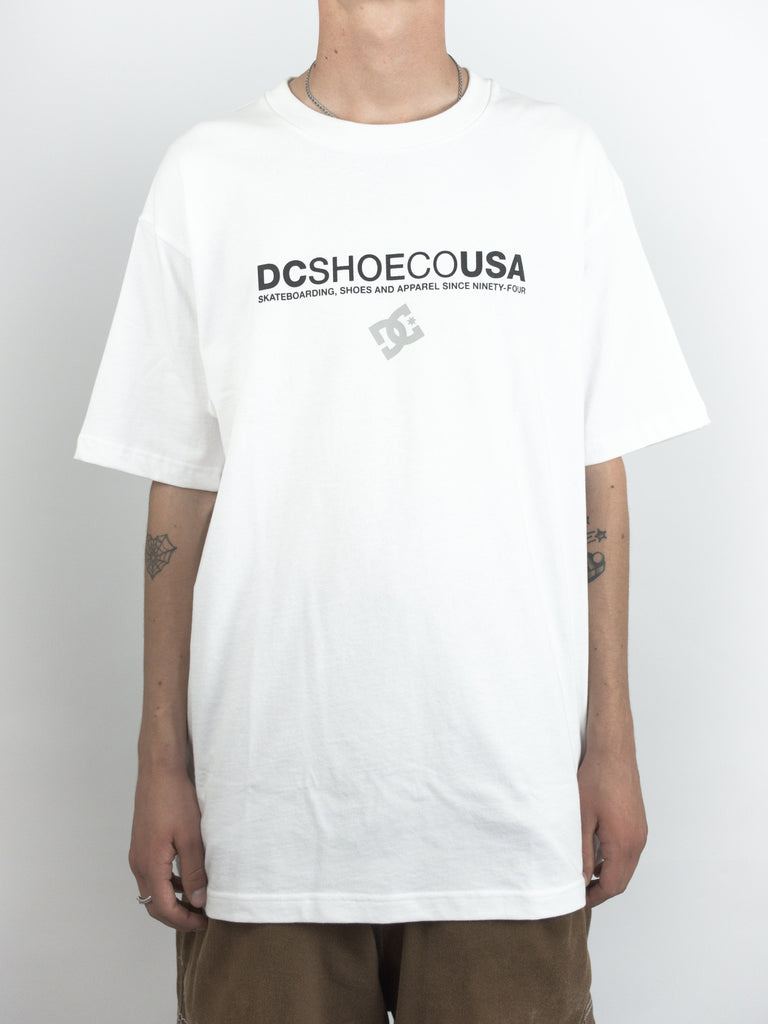 White DCSHOECOUSA t-shirt with logo, available at online skateboard shop Grind Supply