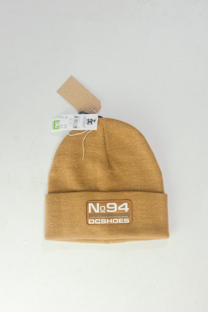 Tan knit beanie with ’No94’’ logo patch.