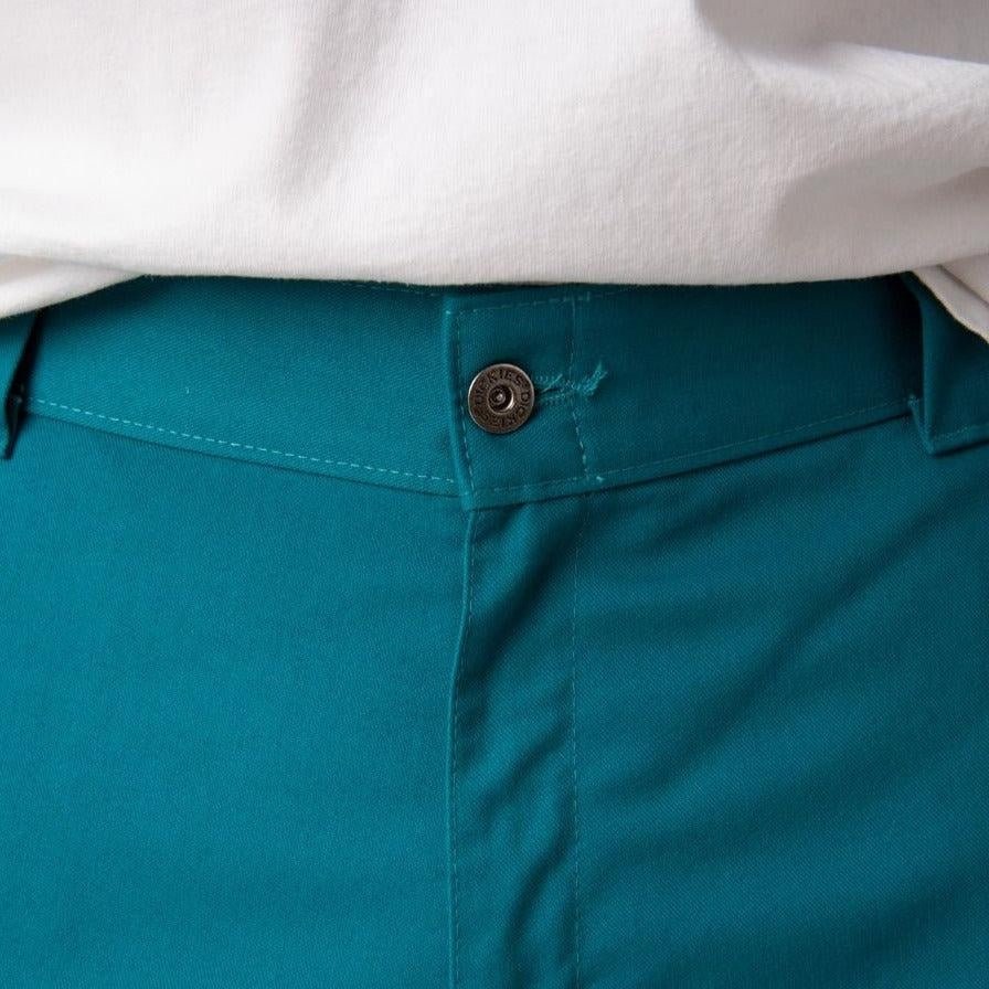 Teal-colored Fanfare Green Dickies Work Pants featuring a metal button at the waistband