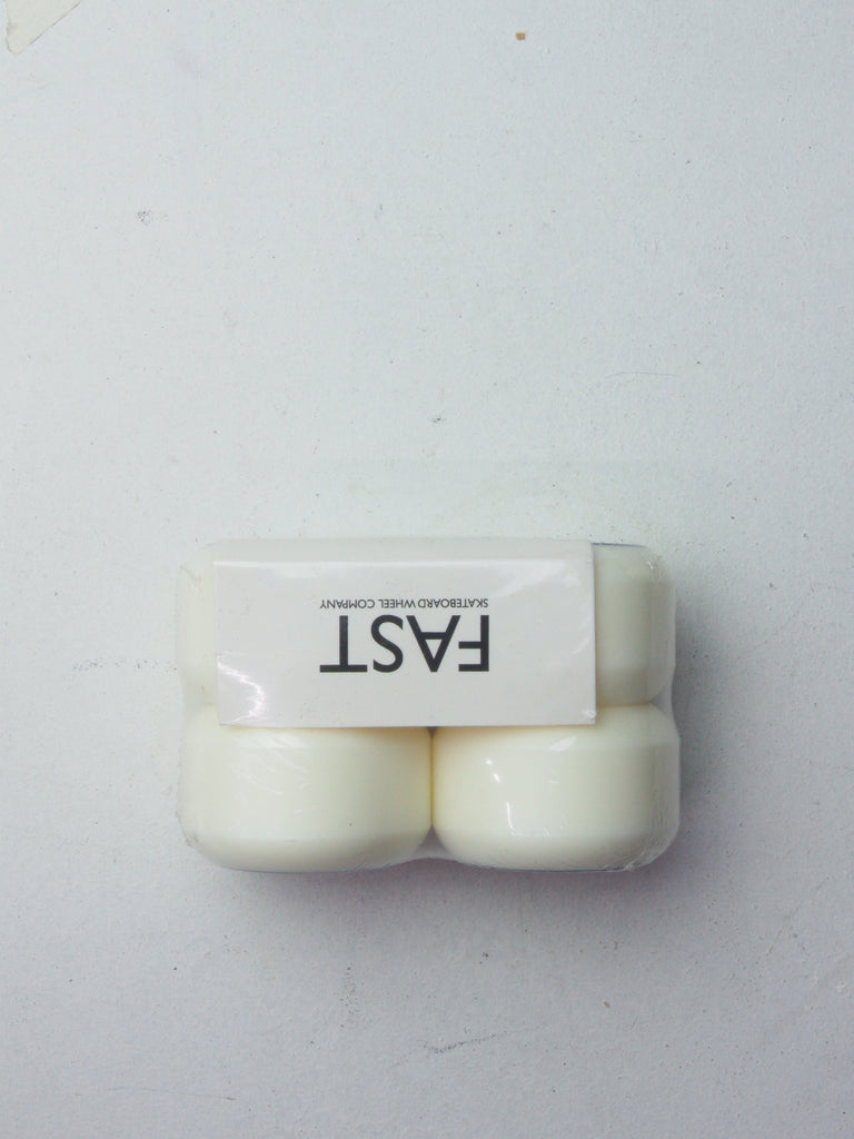 White plastic container labeled ’FAST’ containing what appears to be pills or tablets.