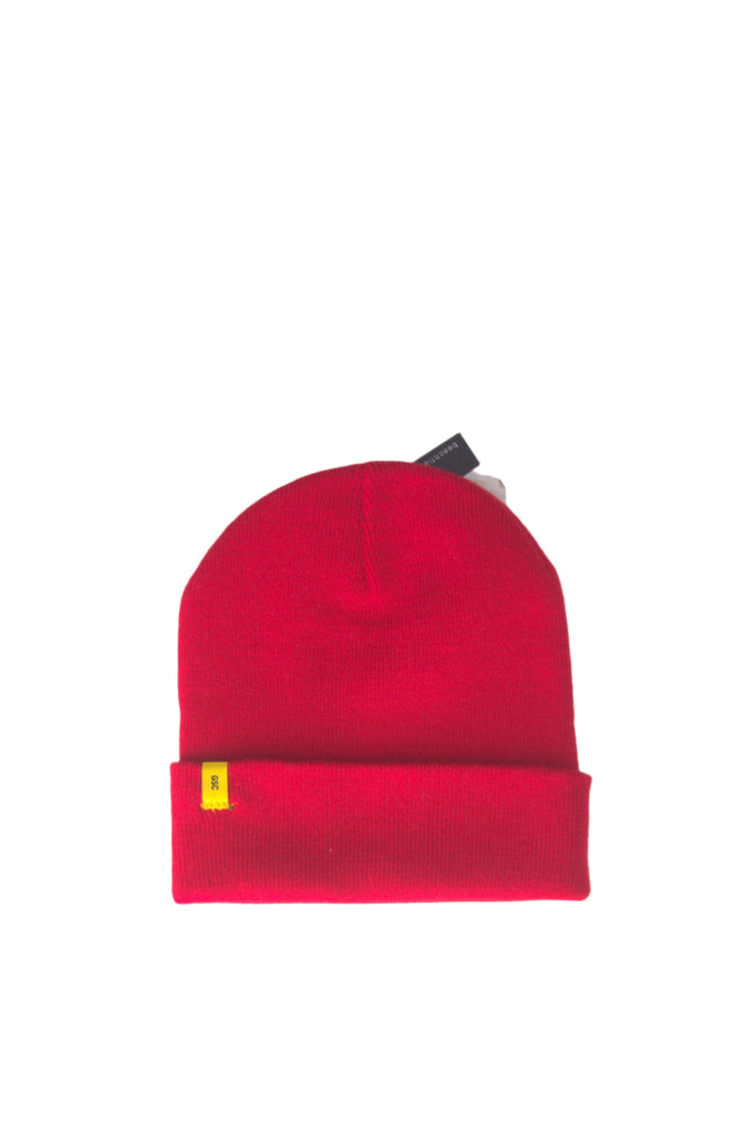 Red knit beanie with a folded cuff and small yellow tag.