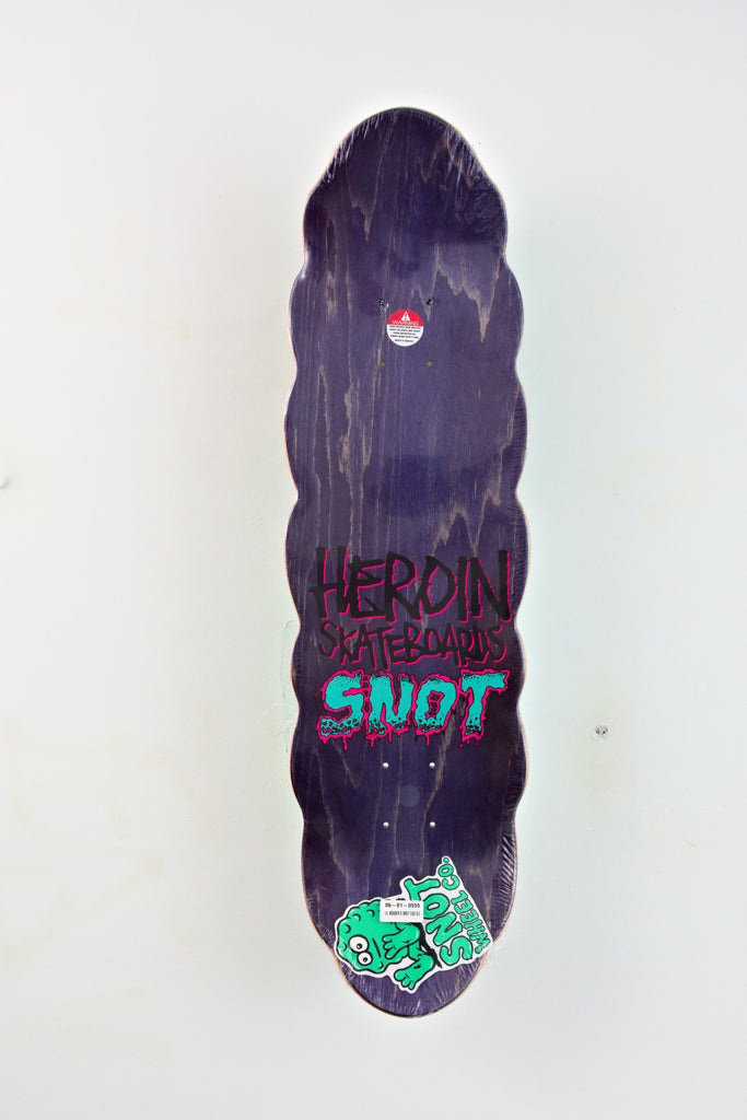 Skateboard deck featuring graffiti-style art from Heroin x Snot collaboration