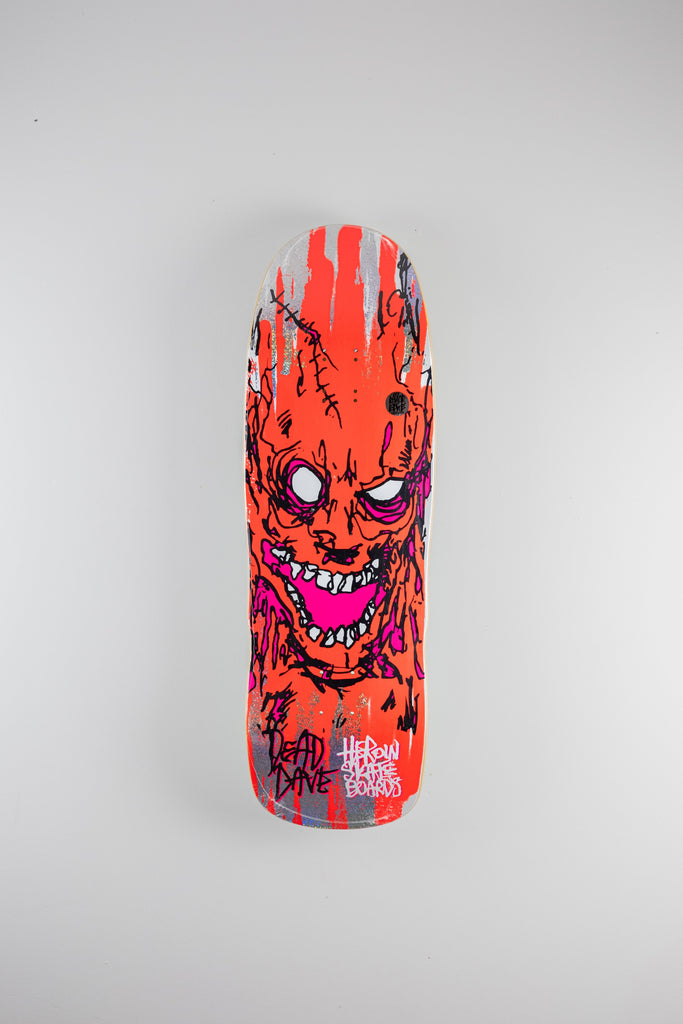 Heroin Skateboards Dead Dave Pro Deck featuring vibrant grotesque zombie face in red and purple