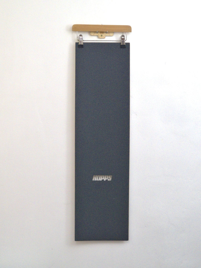 Vertical dark gray clipboard featuring Hopps logo for Big Hopps Grip Tape Sheet 9 x 33