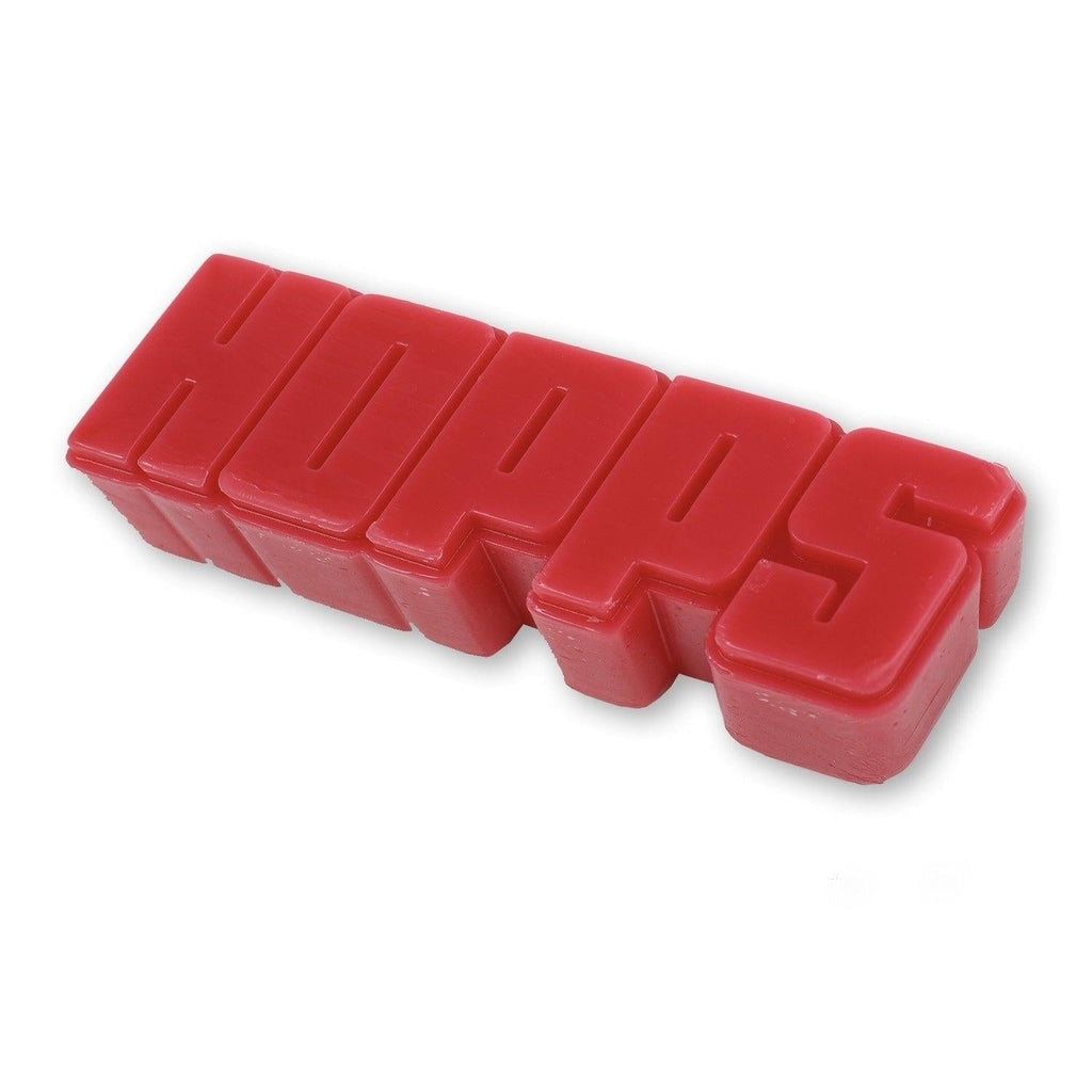 Red plastic wax block spelling HOPPS, perfect for the online skateboard shop Big Hopps