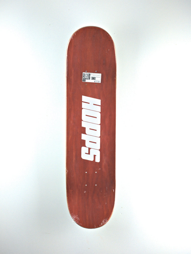 Red skateboard deck with ’Hopps’ branding in white text.