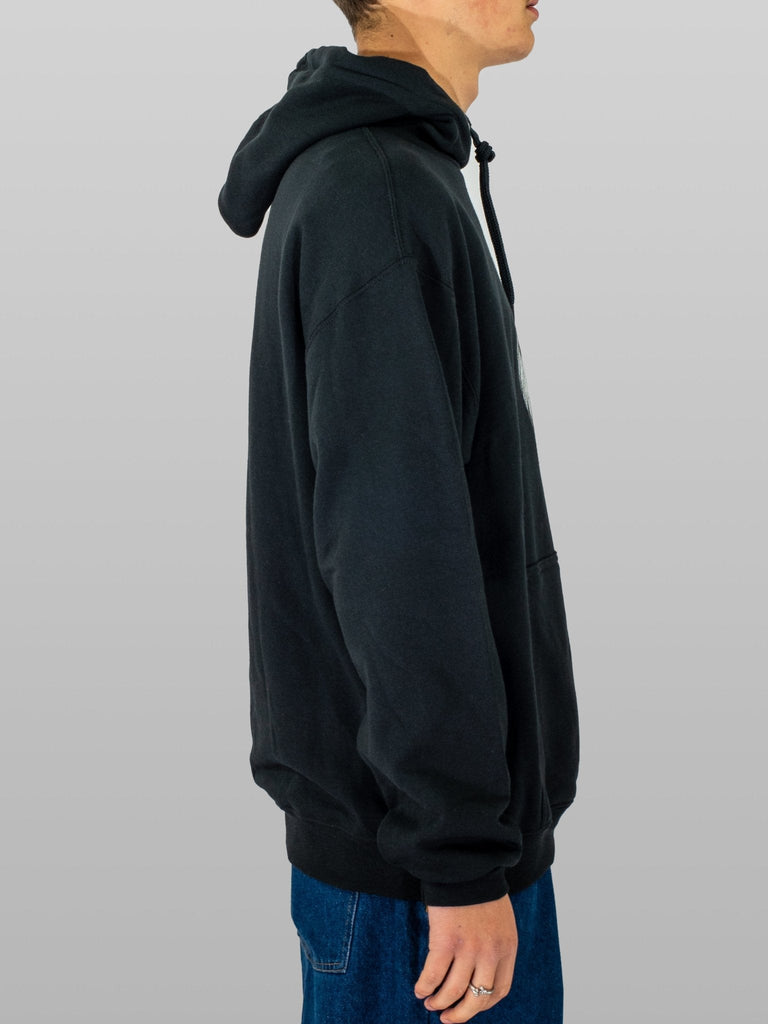 Person wearing a Hopps Lion Hooded Sweatshirt in black from Black Grind Supply