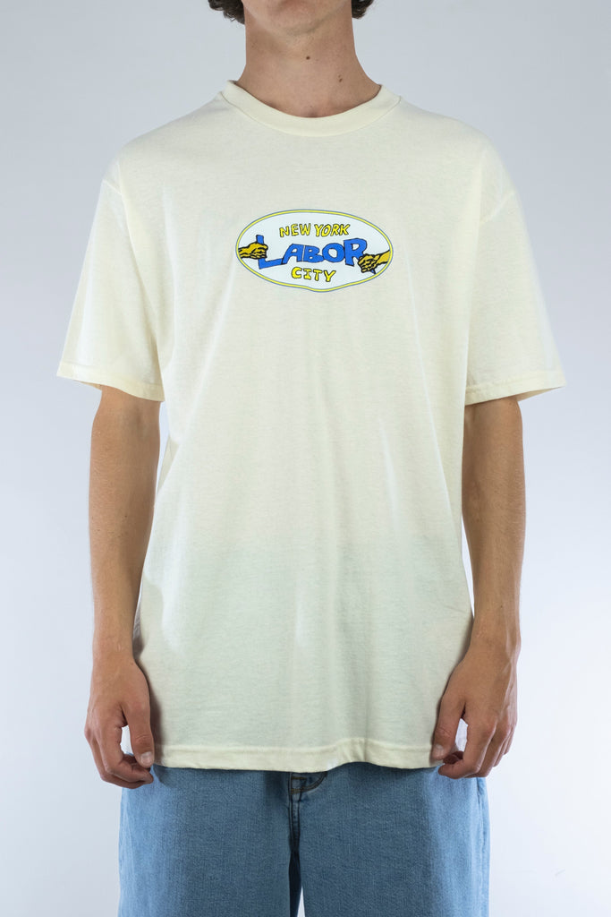 Cream-colored Pullman tee featuring New York City graphic design by Labor - Grind Supply