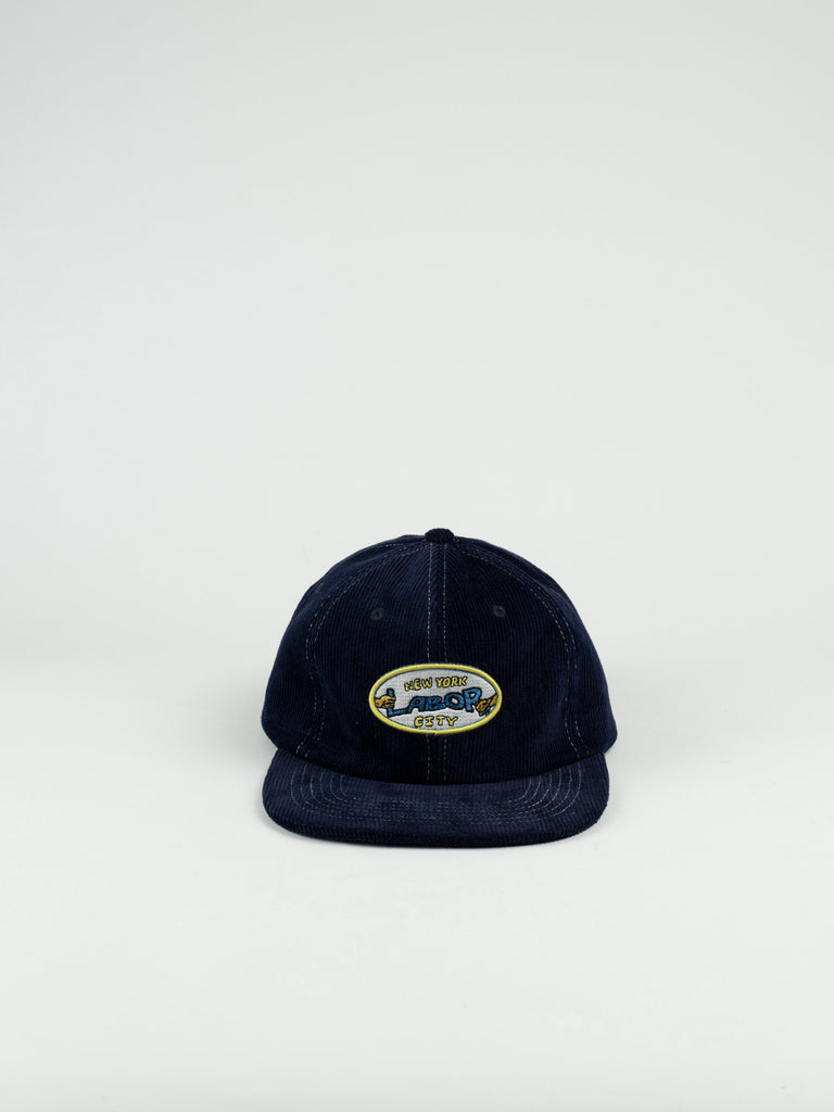 Navy blue baseball cap with an oval patch featuring a vintage car design.