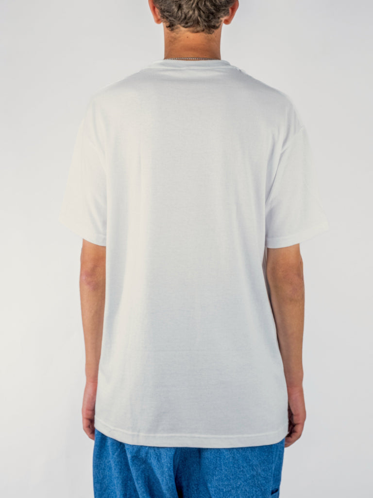 White Labor Sunflower Tee worn from behind, showcasing stylish design for Grind Supply