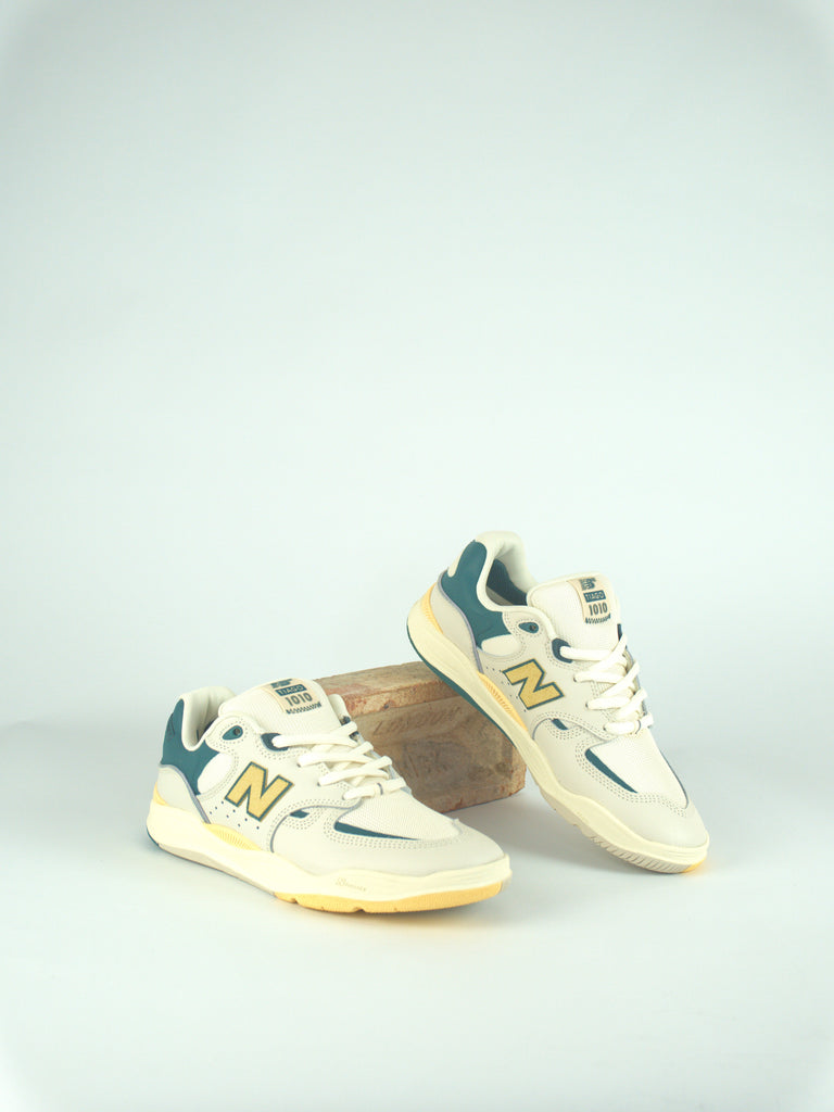 White and teal New Balance Tiago Lemos Pro skate shoes with yellow accents