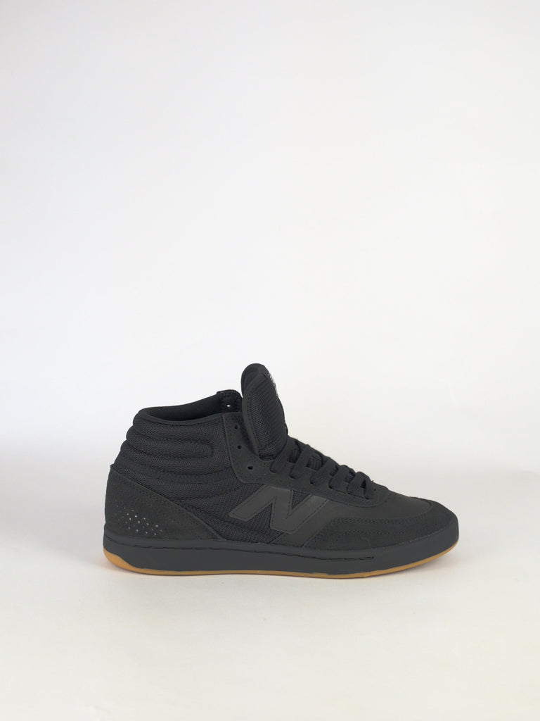 Black high-top sneaker with a gum sole.