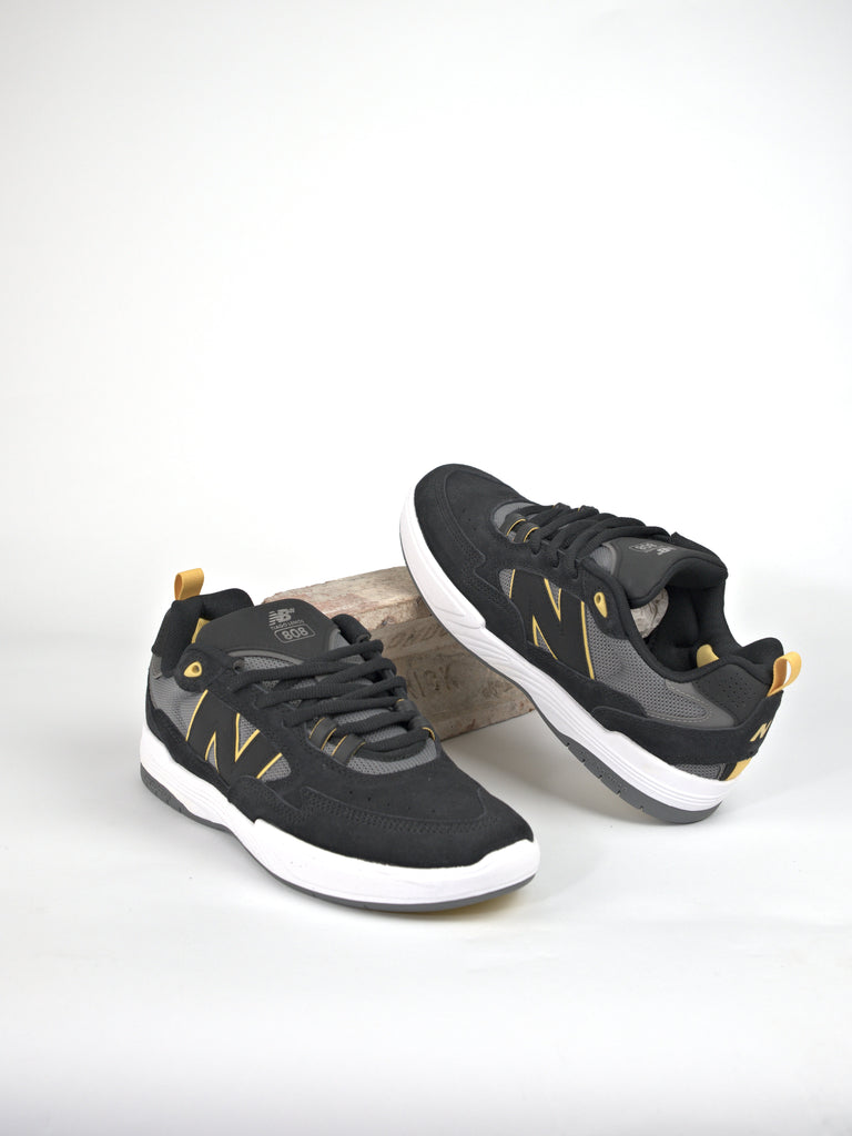 Black and gray New Balance Numeric Tiago Lemos 808’s pro skate shoe with yellow accents