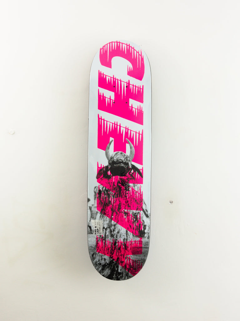 Pink and gray skateboard deck with dripping paint effect.