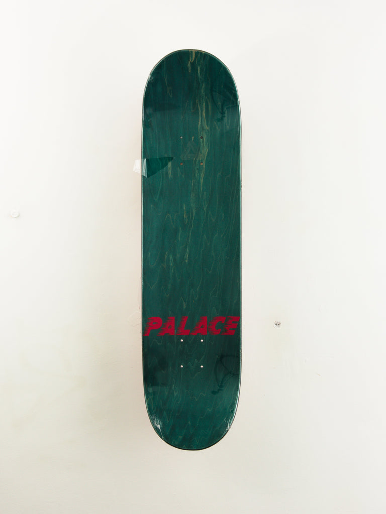 Dark green skateboard deck with red text.