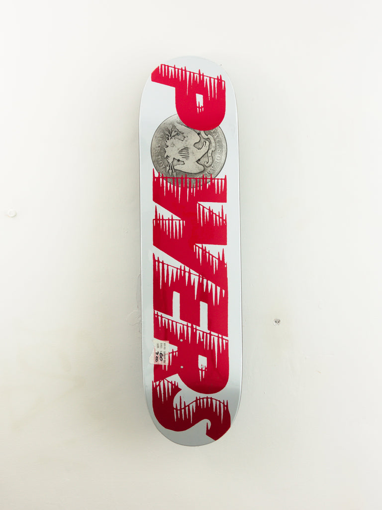 White skateboard deck with dripping red ’PALACE’ text design.