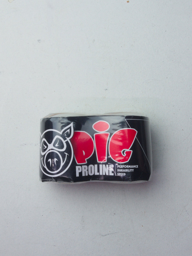 Black skateboard bearing with red ’Pig Proline’ logo and text.