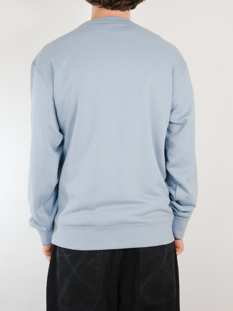 Light blue crew neck sweater showcasing Practice Makes Perfect style in Fog Blue