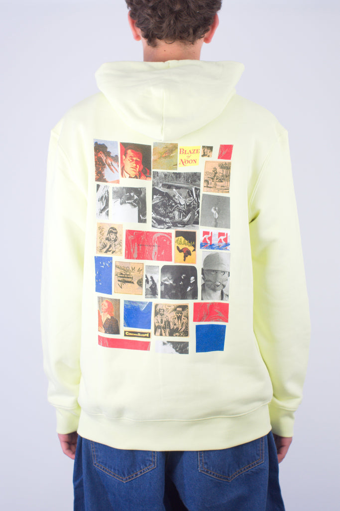 Pale yellow hoodie with a collage of album covers and images printed on the back.