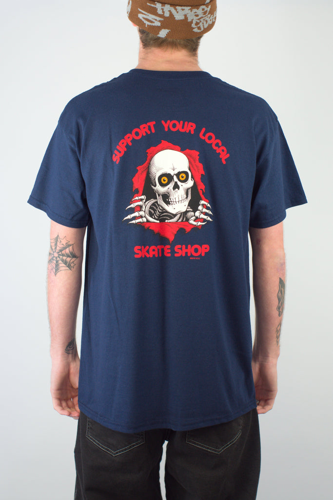 Navy blue Powell Peralta support tee featuring skull design and local skateshop text