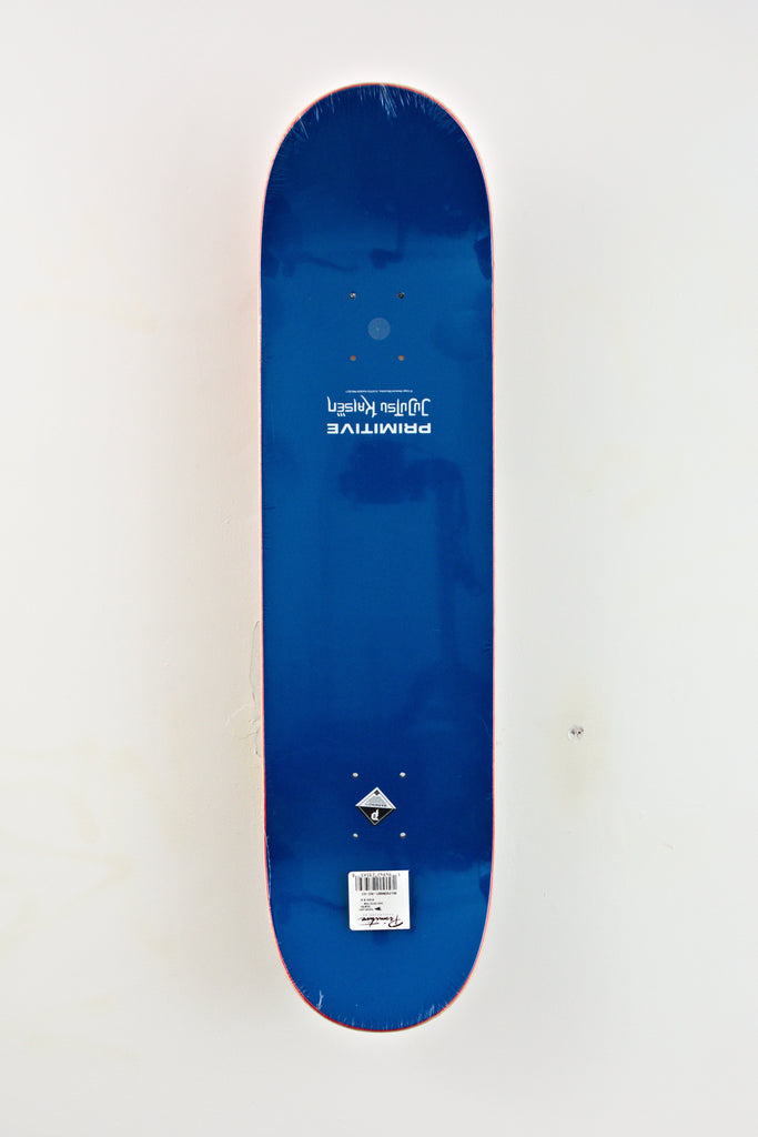 Blue skateboard deck with minimal graphics, featuring Jujutsu Kaisen x Primitive Yuta design