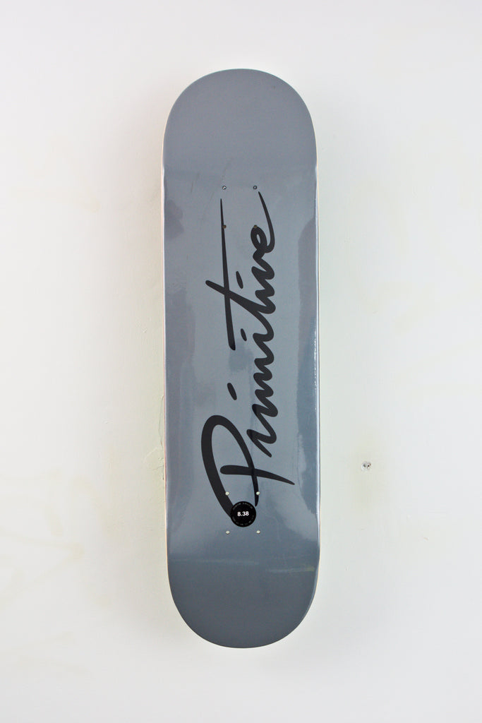 Gray Primitive Nuevo Script Skateboard Deck with black logo displayed at Grind Supply