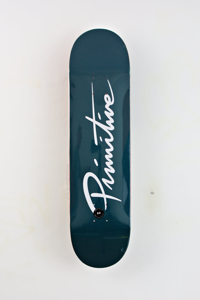 Dark teal skateboard deck with white script lettering on it.