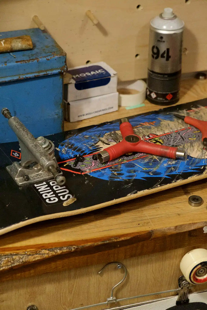 Skateboard with colorful graphic artwork and visible trucks.