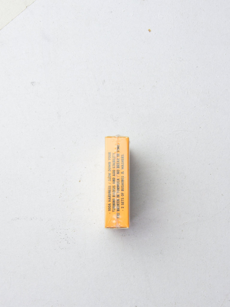 Orange rectangular box or package photographed from above.