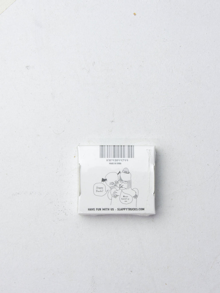 White square package with a barcode and simple line drawing on it.