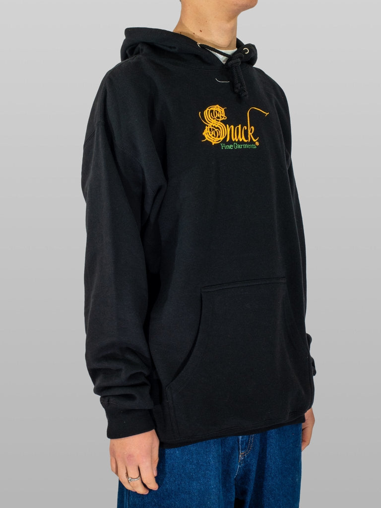 Black hoodie featuring yellow Snuck logo, ultra heavy fleece by Snack Skateboards