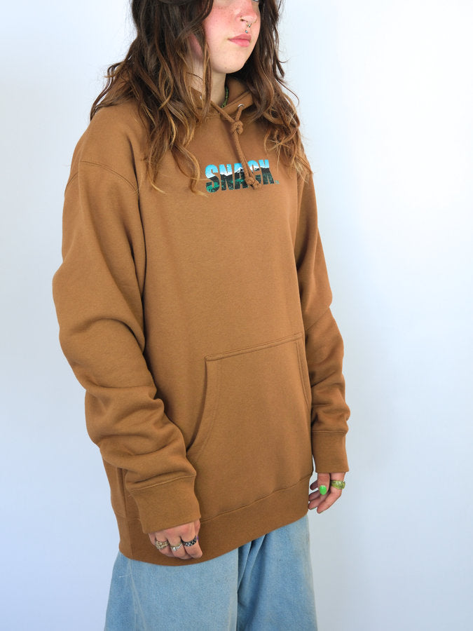 Caramel hoodie sweatshirt featuring SMASH in blue and green from Snack Skateboards Terrain Hoodie