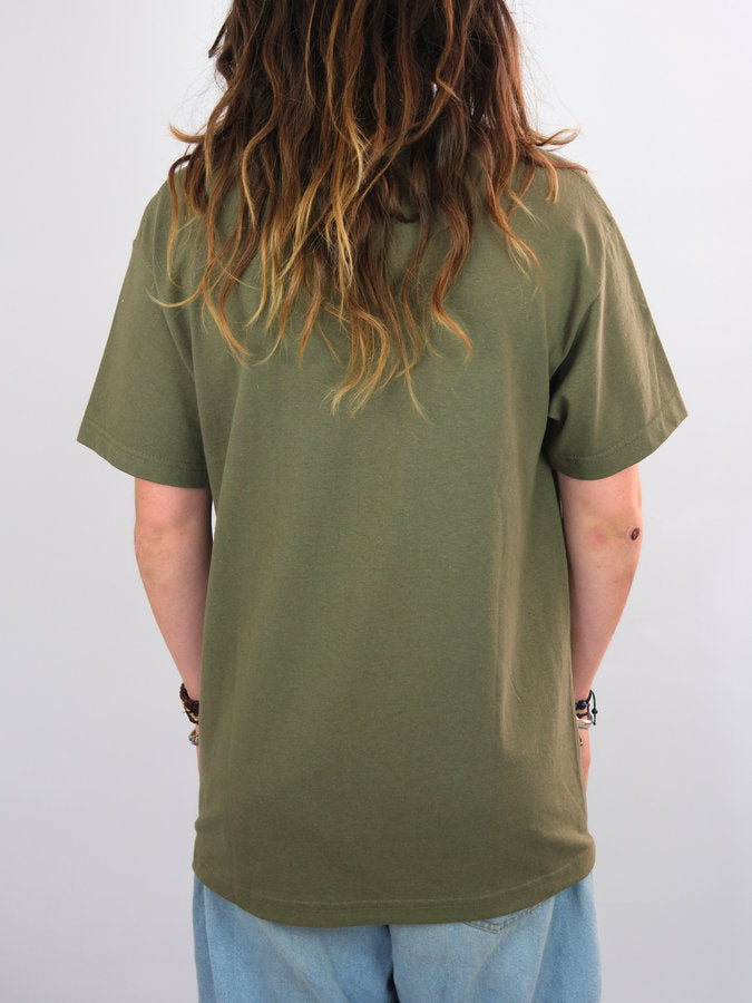 Olive green t-shirt worn by a person with long, wavy hair.