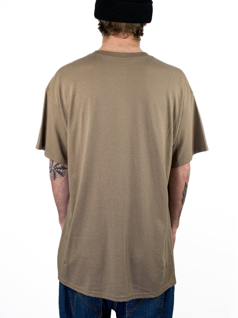 Plain beige western wear tee from Snack Skateboards, worn by a person with tattoos