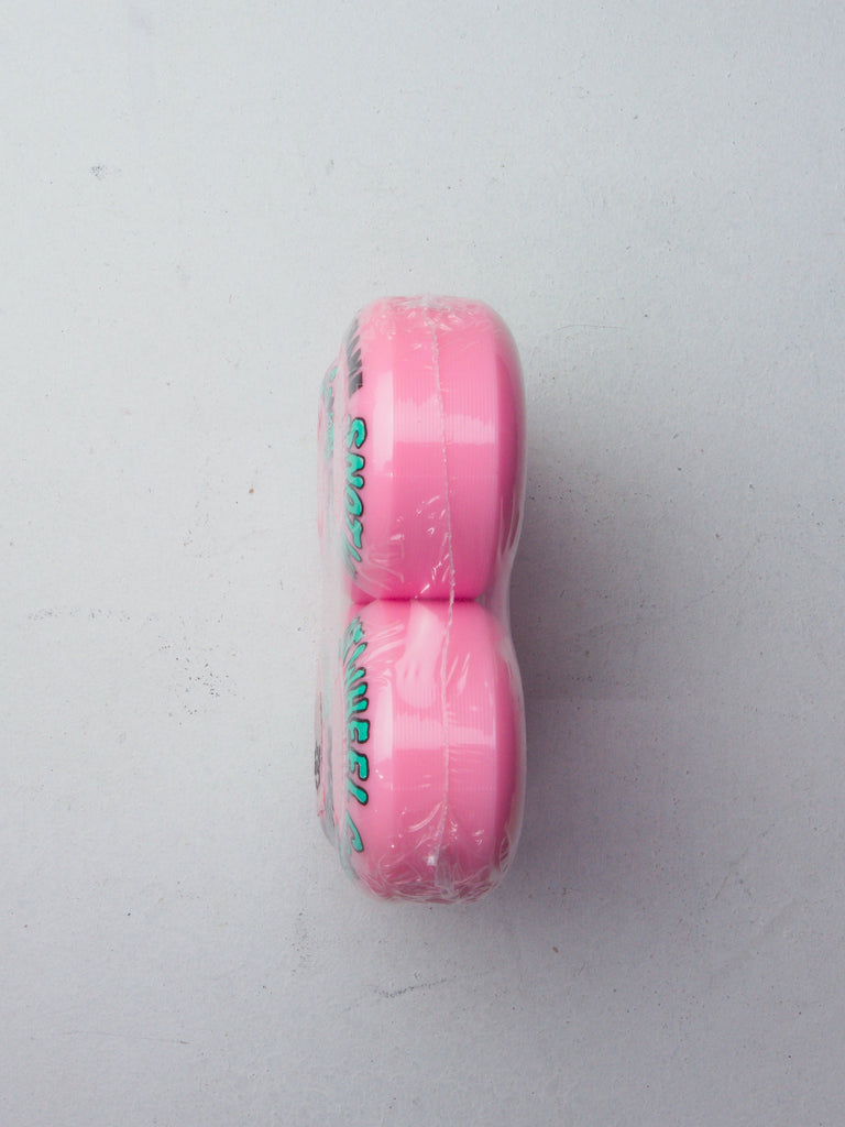 Pink eraser with teal-colored text on its side.