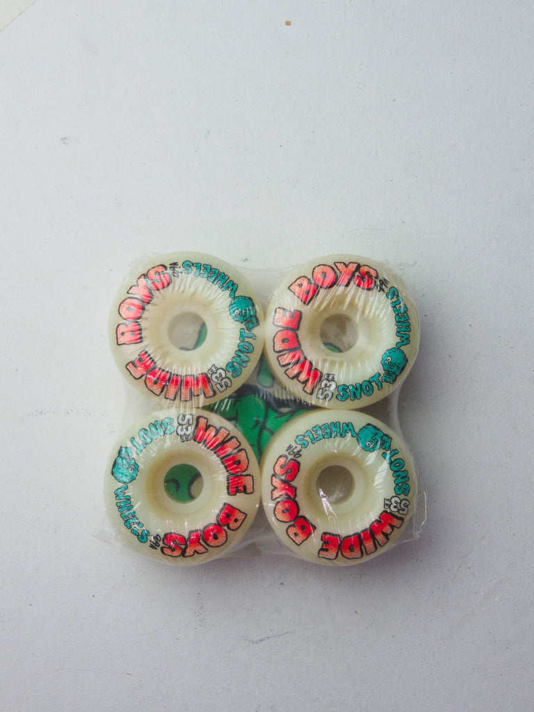 Four white skateboard wheels with red and turquoise graphics printed on them.