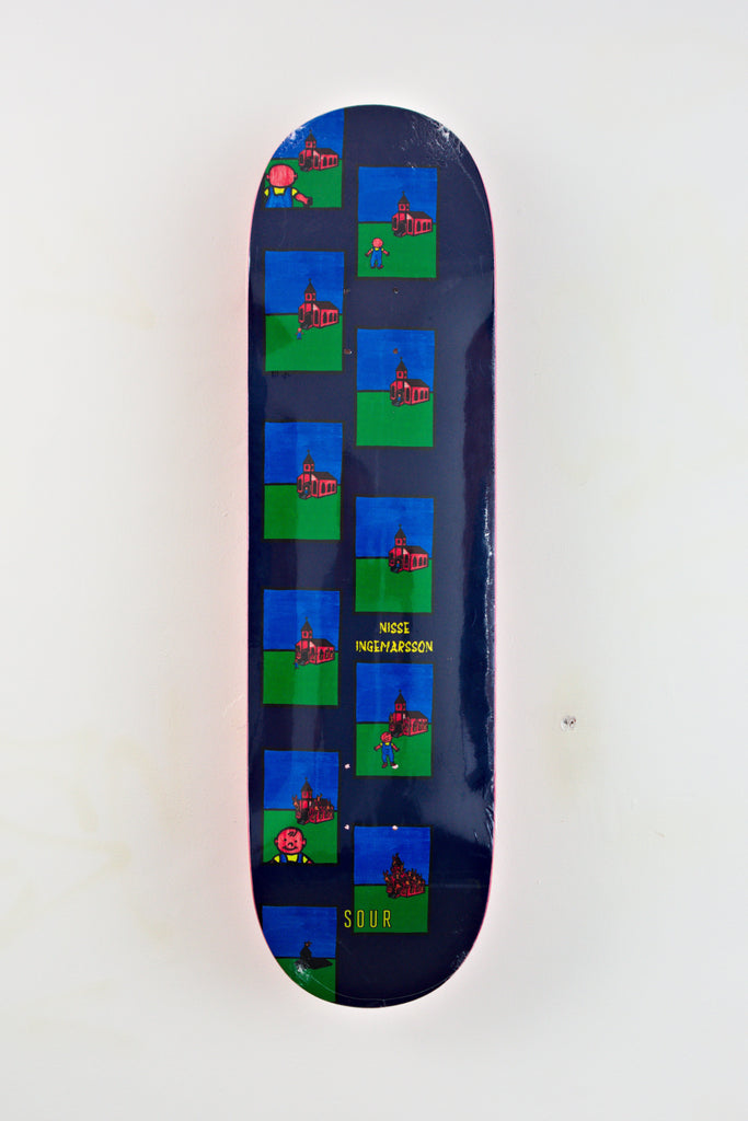 Sour Solution Burn Skateboard Deck featuring a colorful grid pattern with small red buildings