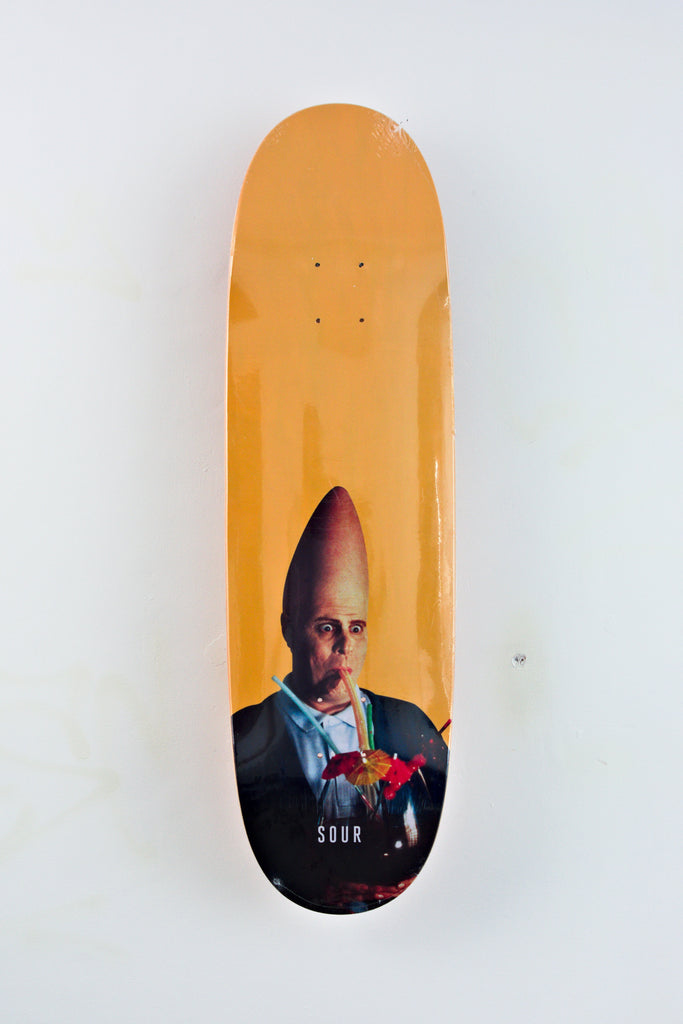 Yellow Sour Solution Conehead Egg Skateboard Deck featuring unique portrait graphic