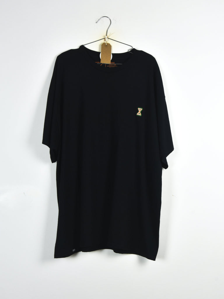 Black t-shirt with a small yellow embroidered logo hanging on a wooden hanger.