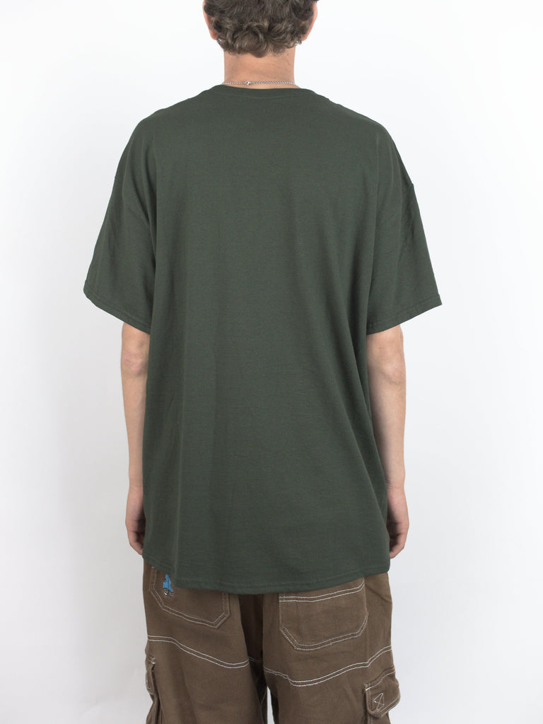 Dark green oversized Infinity Tee worn by a person from behind, showcasing Sour Solution style