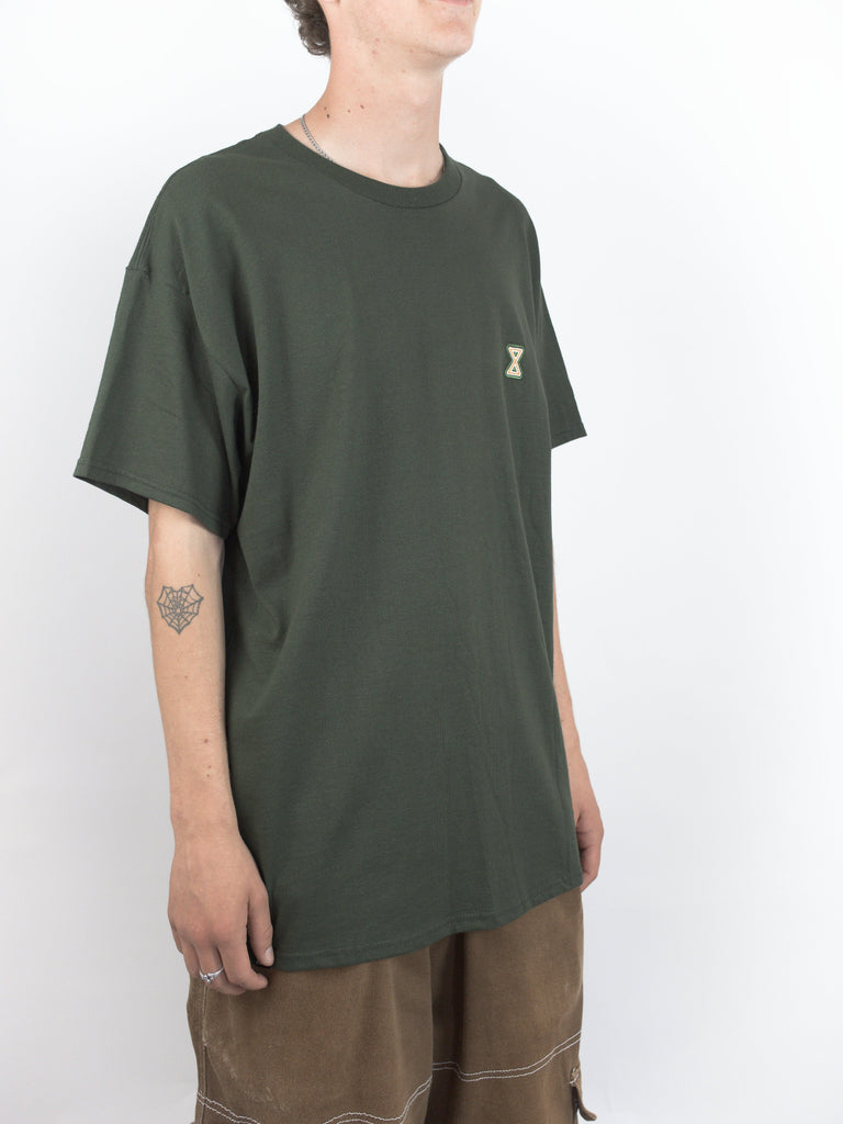 Dark green Sour Solution Infinity Tee featuring a small logo on the chest