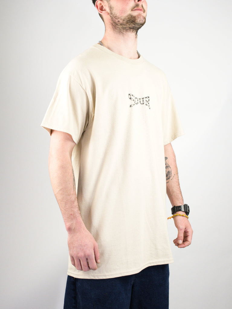 Cream-colored t-shirt with minimal branding on the chest.