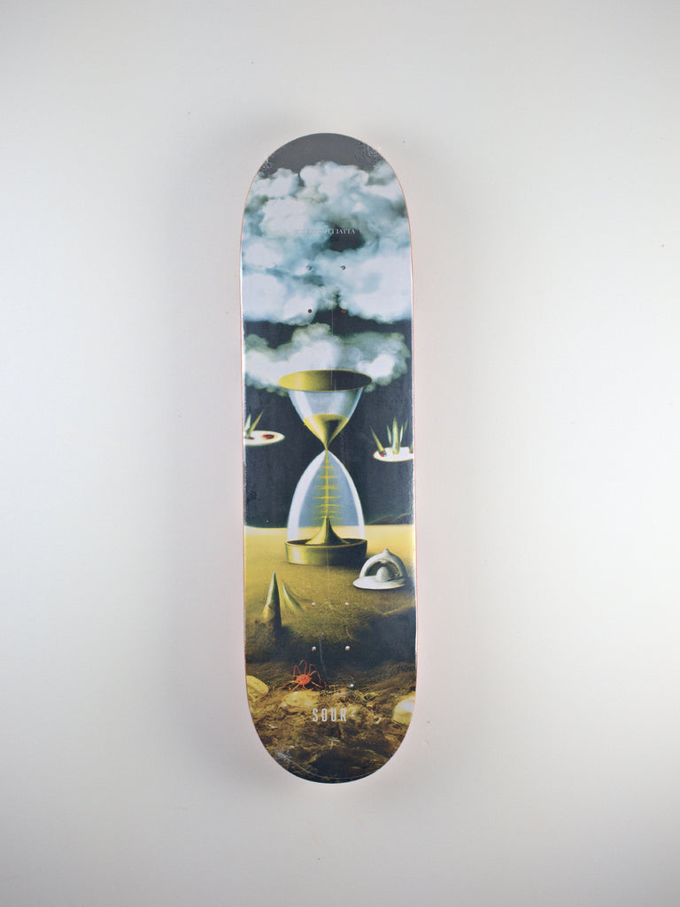 Skateboard deck design featuring a surreal desert landscape by Scott Jatta Poro