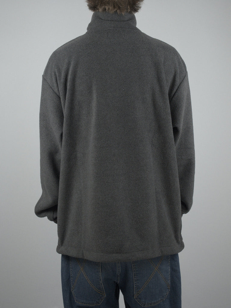 Gray turtleneck fleece pull over worn from behind, featuring Sour Solution Spot Hunter design