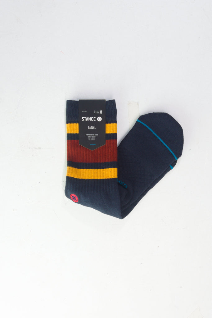 Navy blue sock with burgundy, yellow, and blue striped accents.