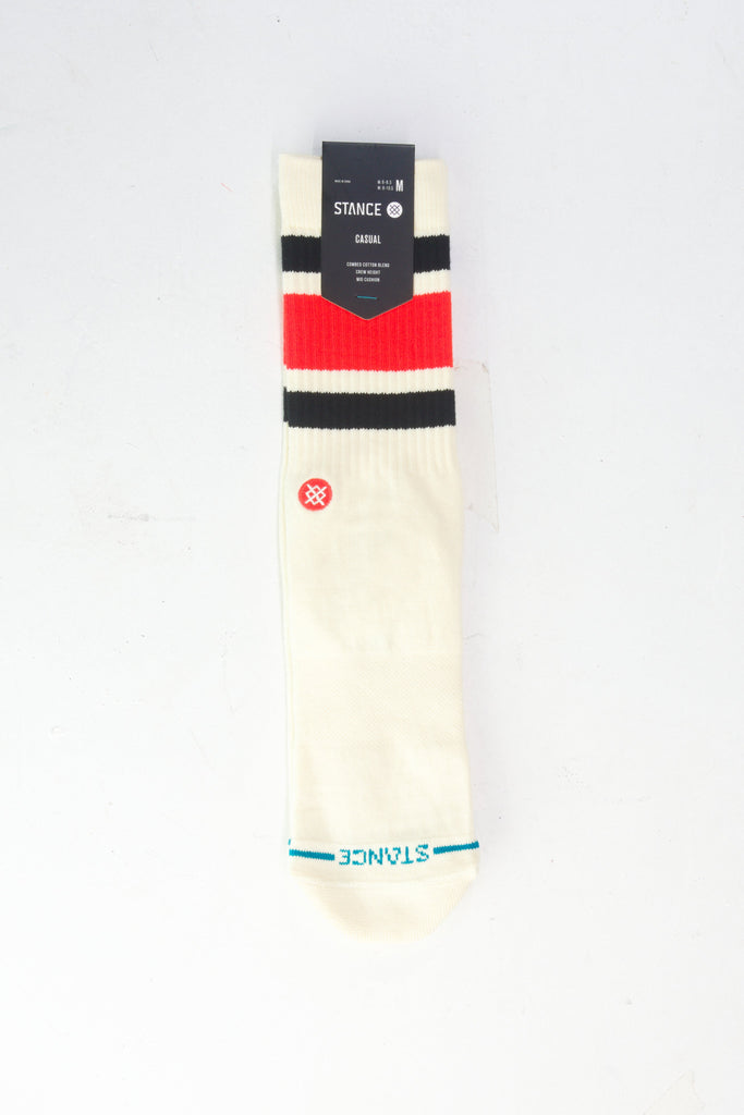 White athletic sock with red and black striped bands and a teal accent near the toe.