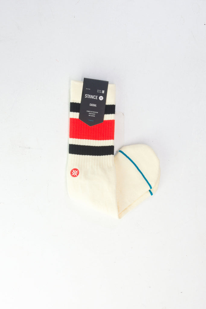 White athletic sock with black and red striped design.