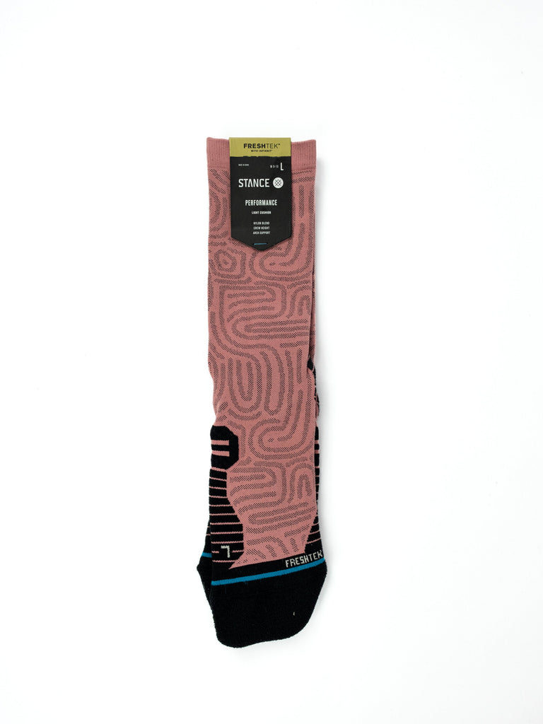 Pink patterned Stance Infiknit Performance Socks with black accents and brand tag