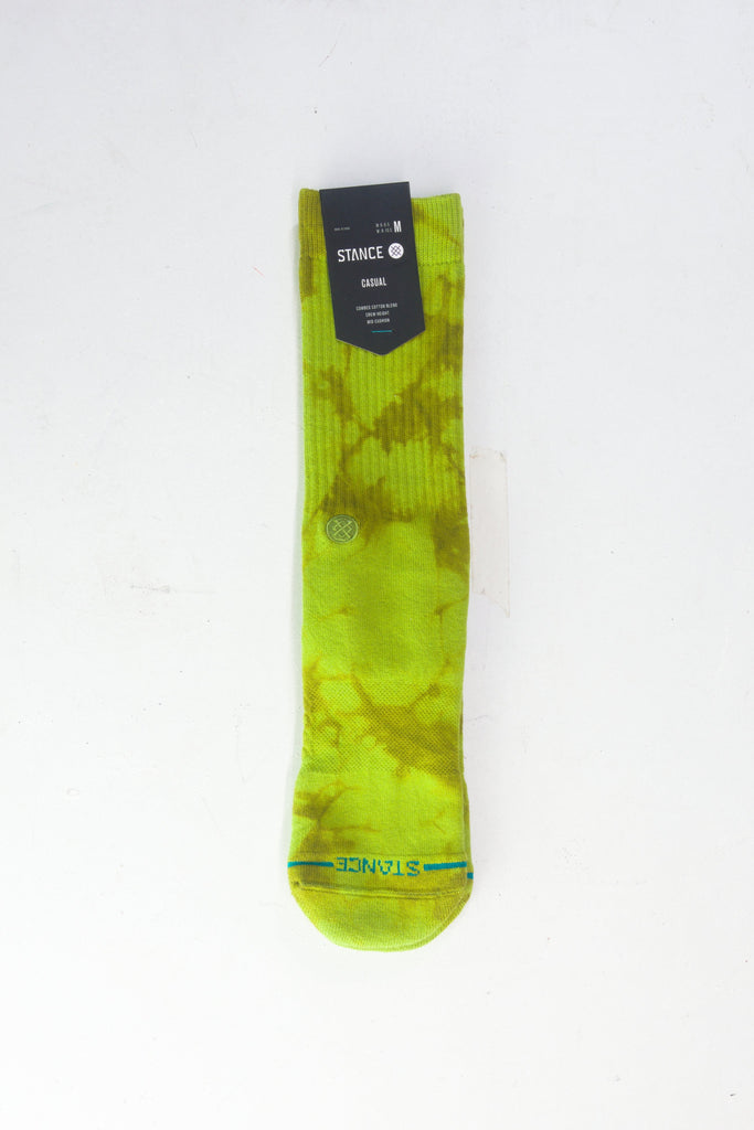 Bright lime-green tie-dyed sock with retail tag attached.